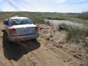 car in sand